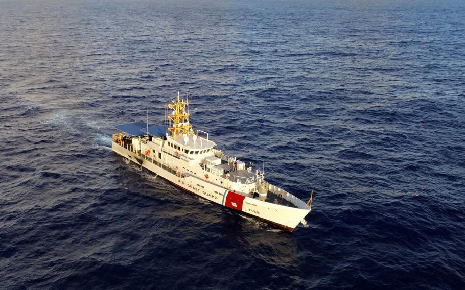 USCGC Myrtle Hazard sails on a dark blue sea.