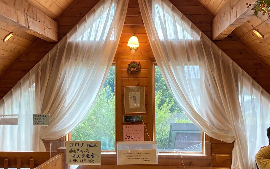 The interior of Berry Cottage's cafe in Ome, Japan, is designed to feel like a charming woodland cottage.