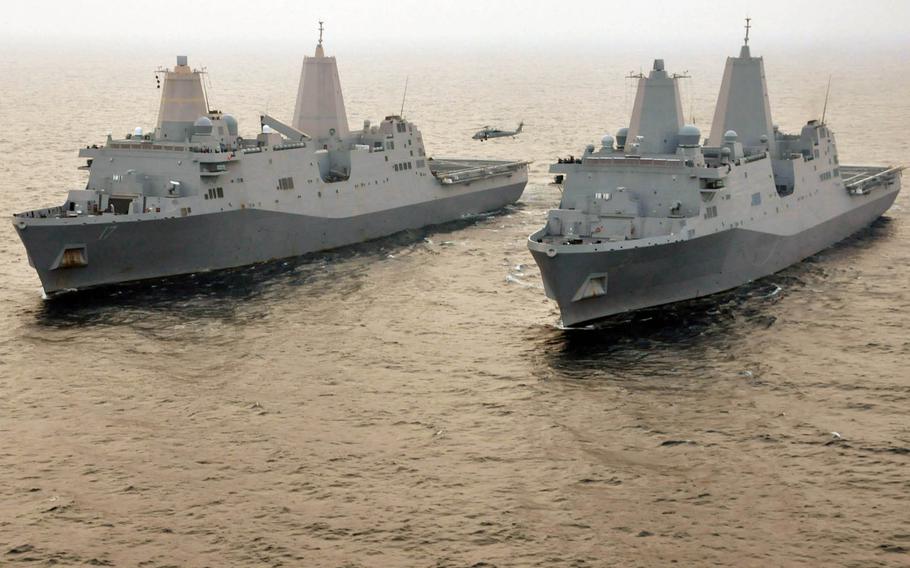 The amphibious transport dock ships USS San Antonio (LPD 17) and USS New York (LPD 21) in the Atlantic Ocean off the coast of Virginia, June 9, 2011. 