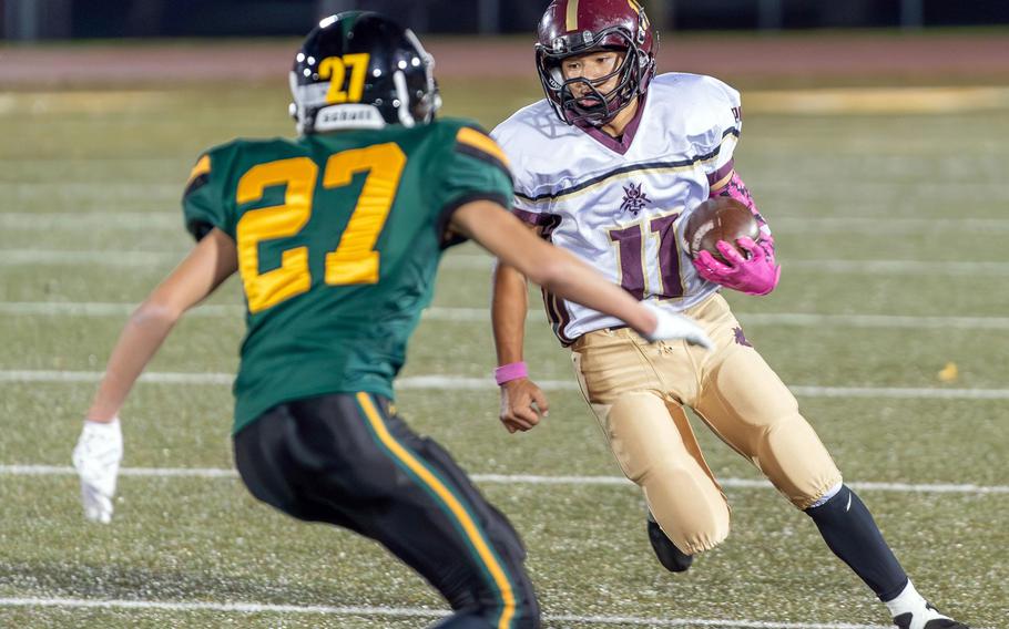 Matthew C. Perry's Kameron Ramos looks for running room against Robert D. Edgren's Ethan Wong.
