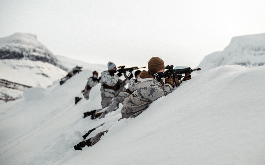 U.S. Marines with the 3rd Battalion, 6th Marine Regiment, 2nd Marine Division, simulate engaging a target March 4, 2022, in preparation for Exercise Cold Response in Setermoen, Norway.