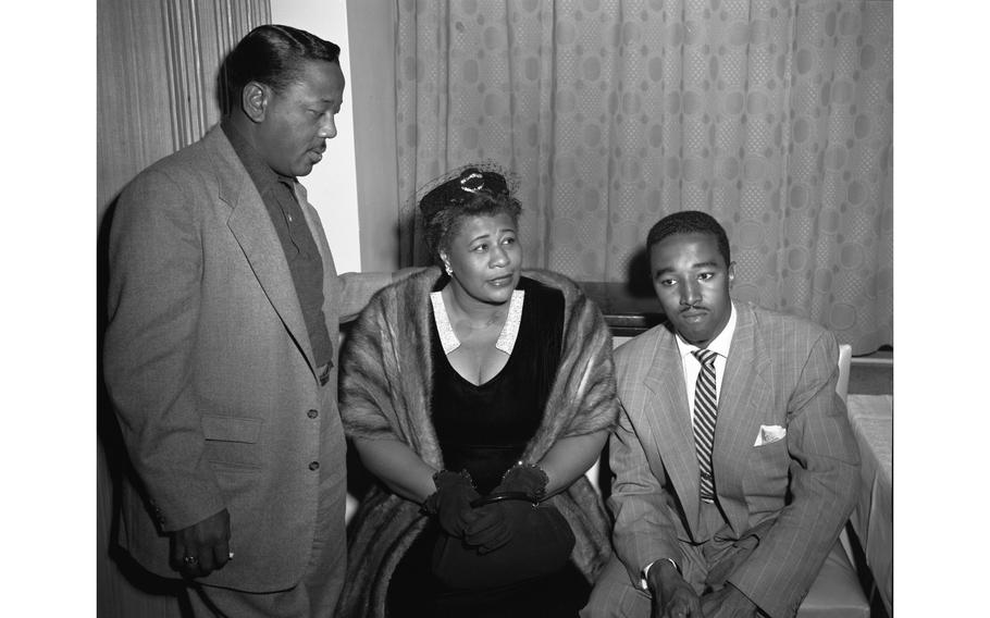 Trumpetman Roy “Little Jazz” Eldridge (left), vocalist Ella Fitzgerald and bassist Ray Brown chat at the Nikkatsu hotel, Tokyo, Nov. 3, 1953. 