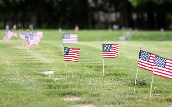 Flags line the rows of headstones  for military service members on Memorial weekend at Lakewood Park cemetery.