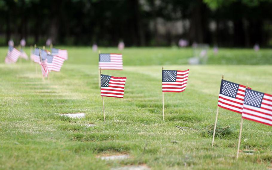 Flags line the rows of headstones for military service members on Memorial weekend at Lakewood Park cemetery.