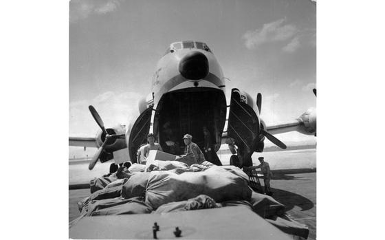 Kimpo Air Base, South Korea, Aug. 26, 1956: Bags and bags of mail get unloaded off of a C-124 Globemaster. The Army Postal Service delivered more than four million pounds of mail and packages to Korea-based soldiers in the first six months of 1956. 

Looking for Stars and Stripes’ historic coverage? Subscribe to Stars and Stripes’ historic newspaper archive! We have digitized our 1948-1999 European and Pacific editions, as well as several of our WWII editions and made them available online through https://starsandstripes.newspaperarchive.com/

Pacific; South Korea; U.S. Army; postal service; military; life; military mail; U.S. Air Force. C-124 Globemaster; plane; aircraft; Gimpo