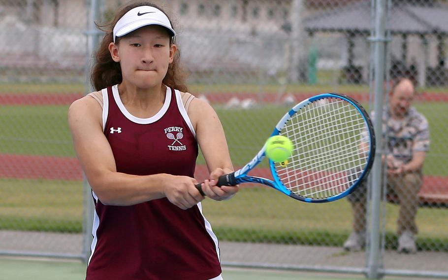 Matthew C. Perry's Sasha Malone hits a two-handed backhand against Zama during this weekend's DODEA-Japan tennis matches. Malone won her singles and doubles matches as the Samurai blanked the Trojans 9-0 in girls play.