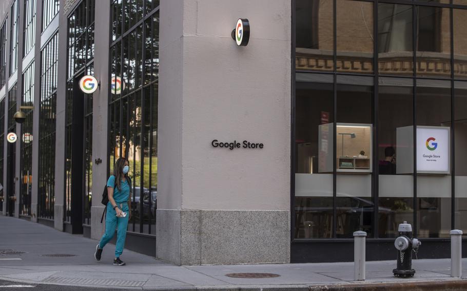 A pedestrian passes in front of the Google Store Chelsea in New York on May 28, 2021. 