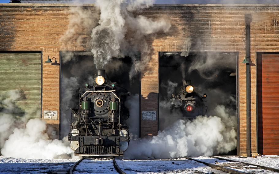 Two of the Nevada Northern Railway’s steam locomotives are prepared for a day of service at the Ely, Nev., rail yard on a February morning. 