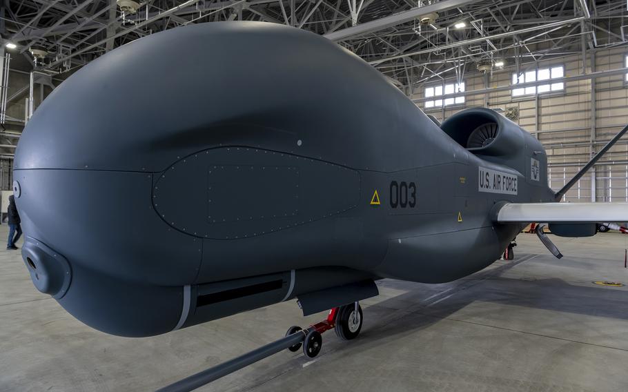 An RQ-4B Global Hawk surveillance drone sits in a hangar at Misawa Air Base, Japan, March 12, 2022. It is the first of three to be operated by the Japan Air Self-Defense Force. 