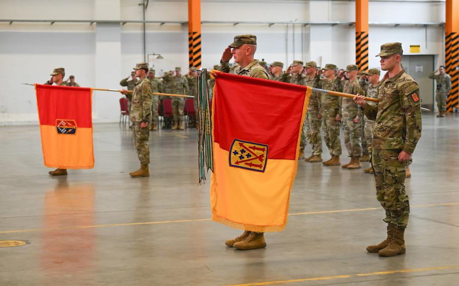 Col. Bruce Bredlow, commander of the 52nd Air Defense Brigade, and Col. Gradey Marcum, commander of the Ohio National Guard’s 174th Air Defense Artillery Brigade, stand and salute during an assumption of command ceremony for the 5th Battalion, 4th Air Defense Artillery Regiment on Aug. 2, 2023, in Ansbach, Germany.