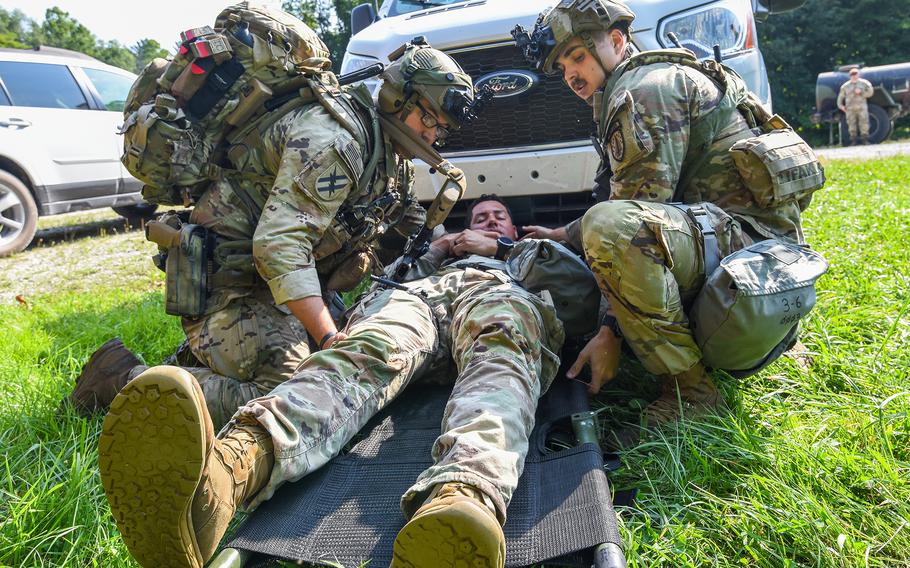 Security Force Assistance Brigade soldiers — known as advisors — help a soldier with a simulated injury during a pre-deployment training exercise Aug. 23, 2023 at Muscatatuck Training Center in Indiana. 