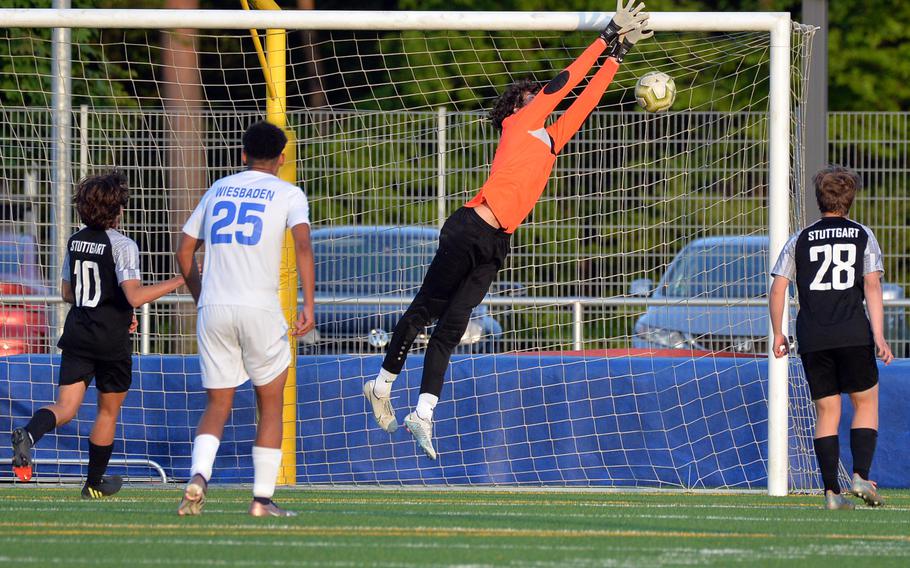 The ball sinks behind the outstretched hands of Wiesbaden keeper Patrick Iverson for Stuttgart’s tying goal in the boys Division I final at the DODEA-Europe soccer championships in Ramstein, Germany, May 18, 2023. Stuttgart beat Wiesbaden 2-1 to win the title.