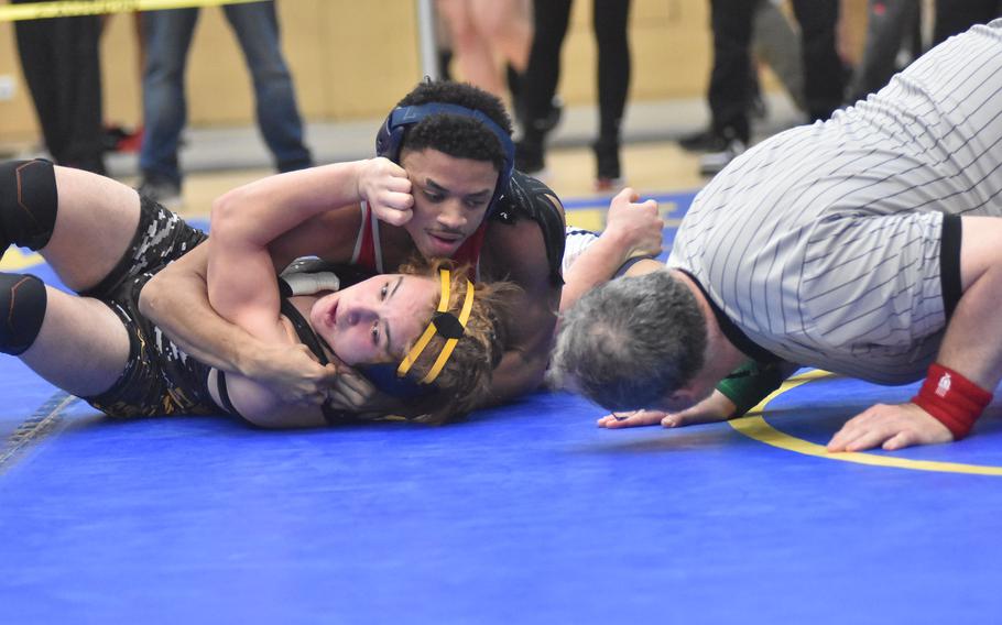 Aviano’s Aaron Smith applies pressure on Stuttgart’s Alex Samler at 157 pounds Friday, Feb. 9, 2024, at the DODEA European Wrestling Championships in Wiesbaden, Germany.