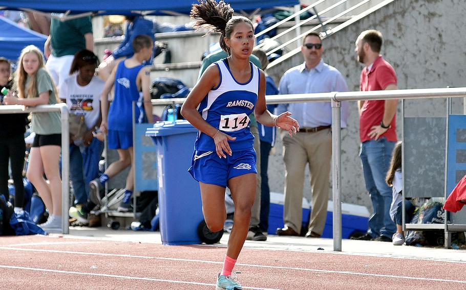 Royal freshman Idaly Lozano approaches the finish line on the track at Ramstein High School on Sept. 30, 2023, on Ramstein Air Base, Germany. Lozano won the race with a time of 20:44.