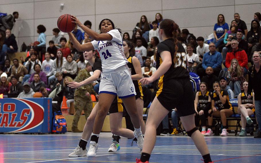 Ramstein's Jasmine Jones catches a pass during a basketball game against Stuttgart on Dec. 8, 2023, at Ramstein High School on Ramstein Air Base, Germany.