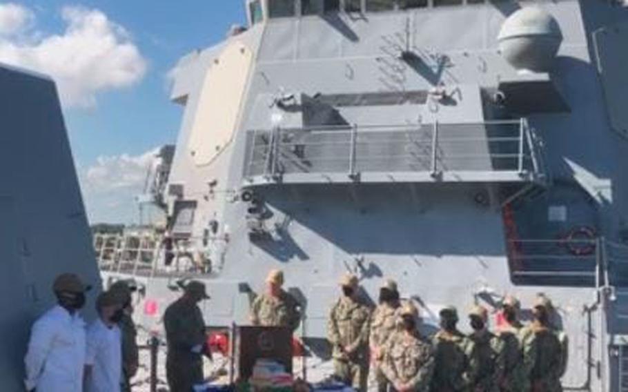 U.S. Navy Rear Adm. Brendan McLane (at podium) announces Task Group Greyhound aboard U.S.S. Thomas Hudner in Mayport.