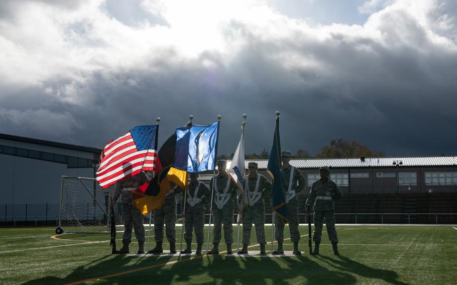 A color guard comprised of students from Kaiserslautern and Ramstein High Schools stands at attention ahead of a Veterans Day march at Kaiserslautern High School, Friday, Nov. 10, 2023.