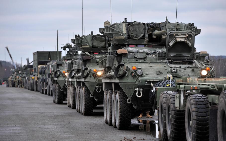 Strykers and other combat support vehicles of the 2nd Calvary Regiment stand on Vilseck Army Airfield, Germany, Feb. 9, 2022, as they are prepared to be shipped to Romania.