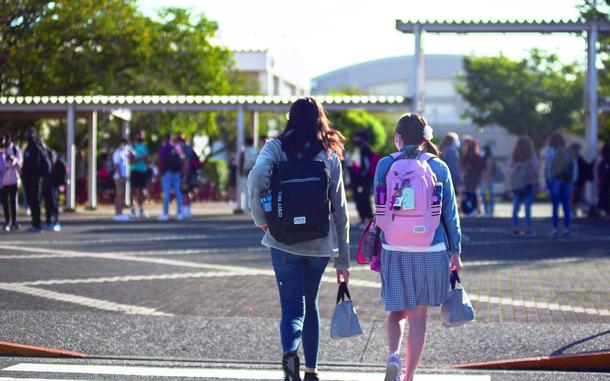 Students walk towards school.