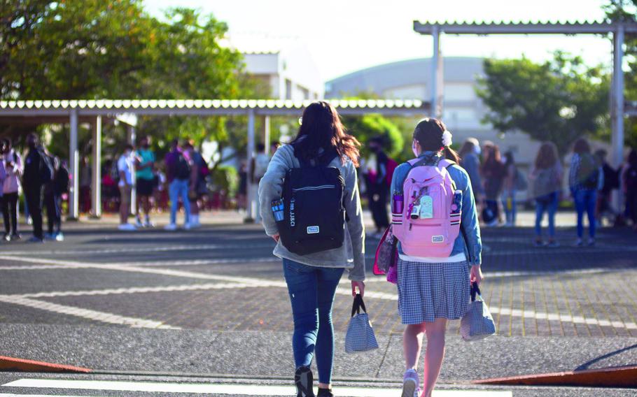 Students walk towards school.
