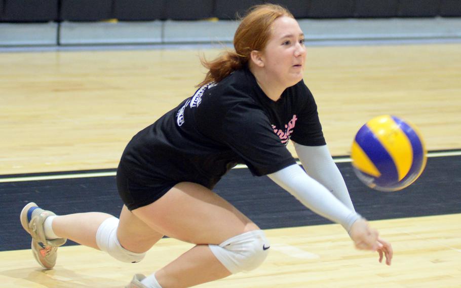 Elysia Koch digs the ball.