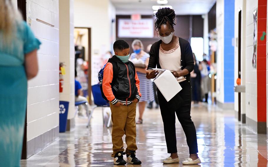 Students arrive for the first day of school in Prince George’s County at Deerfield Run Elementary School in Laurel, Md., on Sept. 5. Prince George’s County Public Schools has placed some employees who are unvaccinated against the coronavirus on leave for not providing weekly virus testing results as required.