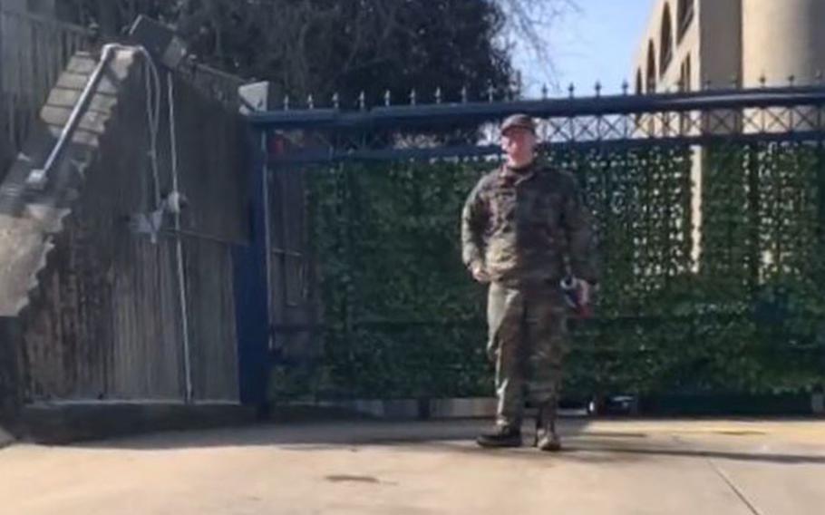 A still image from video shows Senior Airman Aaron Bushnell, moments before he ignited an accelerant fluid he poured over himself in front of the Israeli embassy, Feb. 25, 2024. Bushnell livestreamed his action on the online platform Twitch, which later removed the video. 