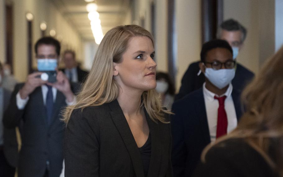 Former Facebook data scientist Frances Haugen, center, departs after a hearing of the Senate Commerce, Science, and Transportation Subcommittee on Consumer Protection, Product Safety, and Data Security, on Capitol Hill, Tuesday, Oct. 5, 2021, in Washington. 