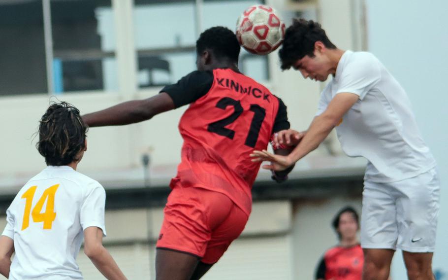 Koboyo Awesso and Ryunosuke Roesch jump to head the ball.