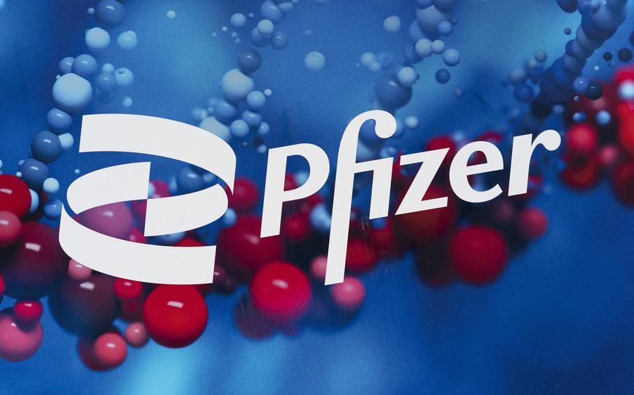 This Feb. 5, 2021, file photo shows the Pfizer logo displayed at the company’s headquarters in New York. 