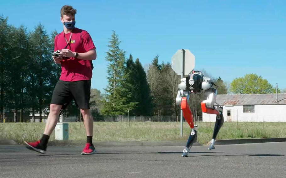 In a screenshot from a video on the Oregon State University YouTube site, Cassie, a bipedal robot developed by the university with funding from Defense Advanced Research Projects Agency, made history by learning how to run and then complete a 5-kilometer outdoor run.