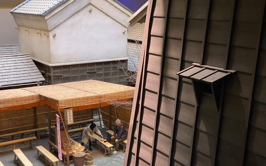 Visitors explore the Fukagawa Edo Museum, which reproduces the Tokyo town of Fukagawa-Saga during the late Edo period. 
