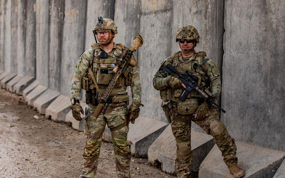 Army Sgt. Robert Russell and Staff Sgt. Dexter Robertson prepare for a patrol in Syria on Feb. 3, 2023. Military investigators are looking into how an aerial drone evaded defense systems in a March 23 attack that killed an American contractor and wounded five service members as well as another contractor at a base in Syria, U.S. officials said.