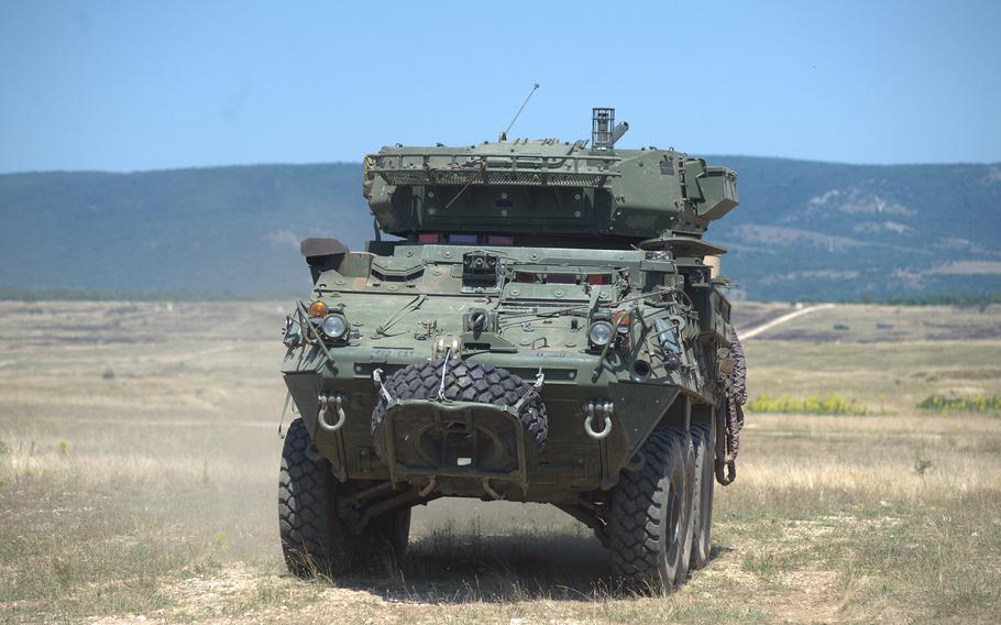 A U.S. Army Stryker vehicle moves across a firing and training range.