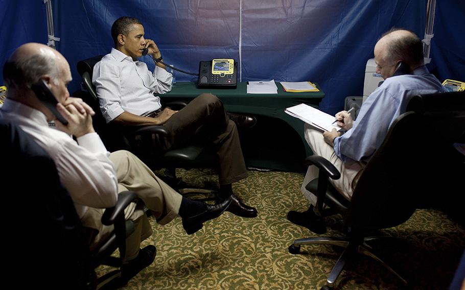 Then-President Barack Obama is briefed on a situation in Libya during a secure conference call inside a tent in Brazil in 2011. The tent acted as mobile SCIF (sensitive compartmented information facility), designed to allow officials to have top-secret discussions while on the move. 