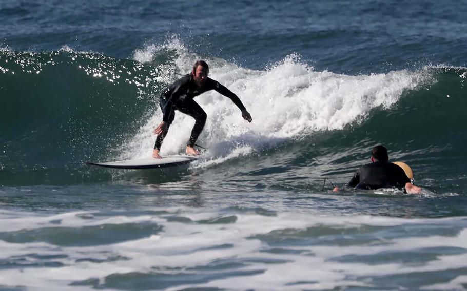 Braden Walker rides a wave at Westward Beach in Malibu, Calif. 