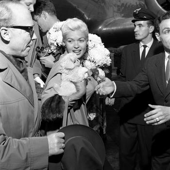 Actress Jayne Mansfield arrives at the Frankfurt airport, Oct. 4, 1957. The actress flew in from Paris where she attended the French premier of her latest movie "Will Success Spoil Rock Hunter." The actress will tour several Army installations in and around Frankfurt. 