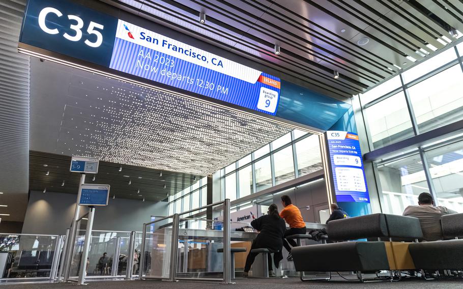 The new High C gates at Dallas Fort Worth International feature massive digital signs so that passengers can see their flight’s status from across the terminal. 