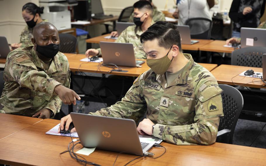 Soldiers use a computer lab at the D.C. Armory in Washington on May 16, 2021. National Guardsmen and Army Reservists may soon be able to search a database for short-term duty assignments on their smartphones. 