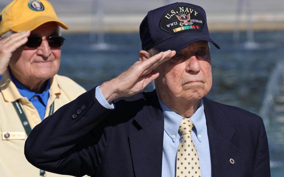 World War II veteran Callan Francis Saffel salutes as the national anthem is played during a Memorial Day ceremony at the National World War II Memorial in Washington, D.C., May 31, 2021.