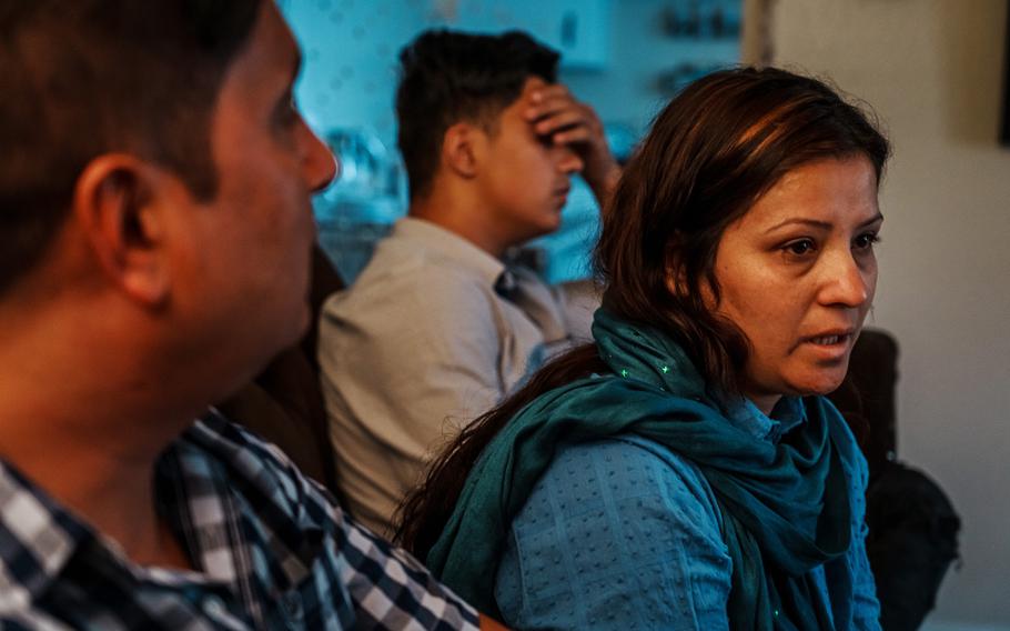 Zabiullah Musafer, 43, wife Yalda, 34, and son Sefatullah, 18, at their new home in Sacramento, Calif., on Aug. 17, 2022. 