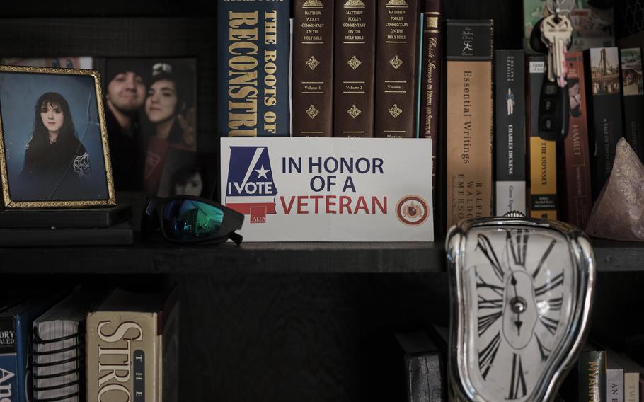 A sticker honoring U.S. military veterans sits on display in the family home of Joy Black, Andy Tai Huynh's fiancee. 
