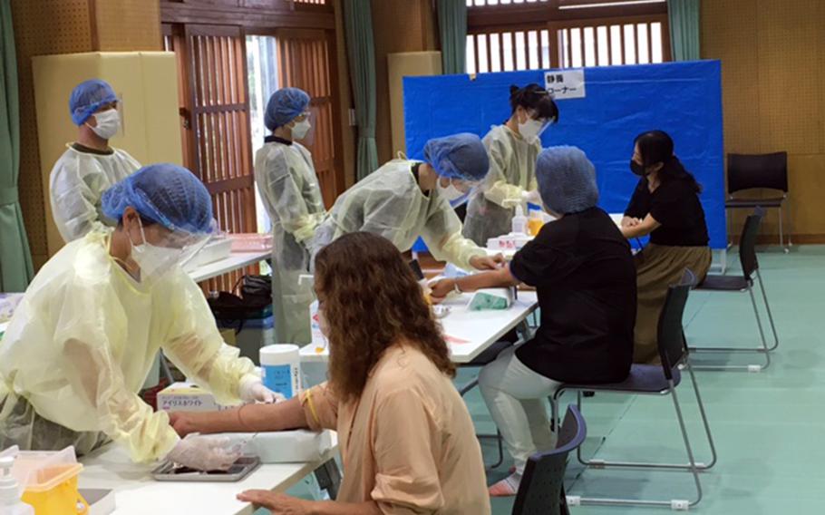 Blood samples are taken on behalf of Liaison to Protect the Lives of Citizens Against PFAS Contamination, at a community center in Ginowan, Okinawa, July 10, 2022. 