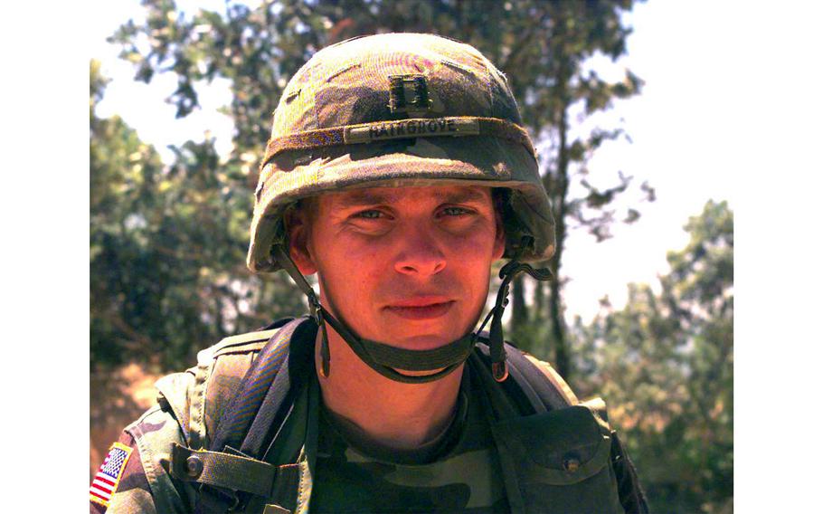 Capt. Tom Hairgrove, with 1st Brigade, 1st Armour Division, Task Force Charlie 1-36, on watch at Checkpoint Sapper, Kosovo, July 6, 2000.