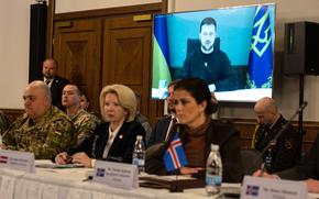 Ukrainian President Volodymyr Zelenskyy speaks to an audience of NATO member officials at the Ukraine Defense Contact Group meeting, Jan. 20, 2023, at Ramstein Air Base in Germany. The next meeting of the group will take place Feb. 14 at NATO headquarters in Brussels.