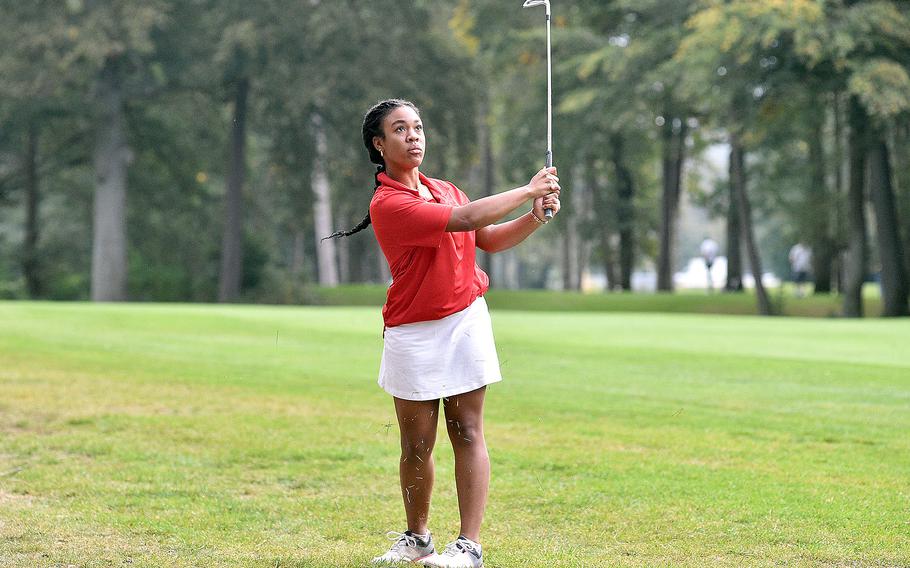 Kaiserslautern's Asia Andrews follows her shot on the No. 2 hole at Woodlawn Golf Course on Ramstein Air Base, Germany, during the first round of the DODEA European championships on Oct. 12, 2023.