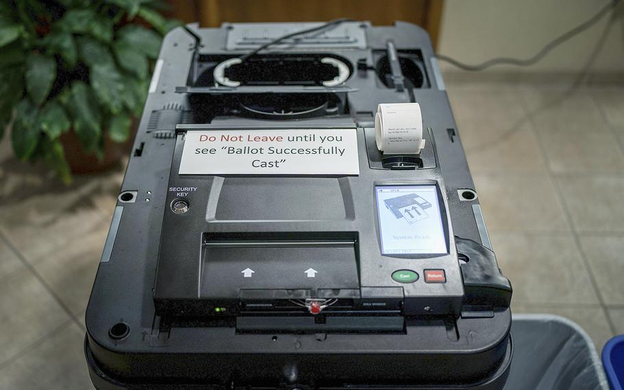 A Dominion voting machine is set up ahead of the precinct at Christian Reform Church opening up for Michigan’s primary election day on Aug. 2, 2022, in Grand Rapids, Michigan. 