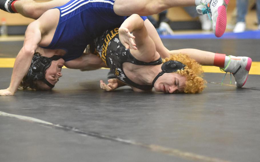 Ramstein’s Jayden Andrews drags Stuttgart’s James Prudhomme across the mat Friday, Feb. 9, 2024, in a match at 138 pounds at the DODEA European Wrestling Championships in Wiesbaden, Germany.