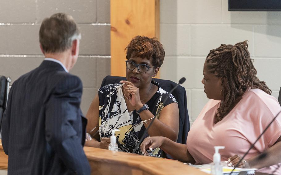 Civil Miller-Watkins, center, attends a meeting of the Fayette County Board of Education on June 2 in Somerville, Tenn. 
