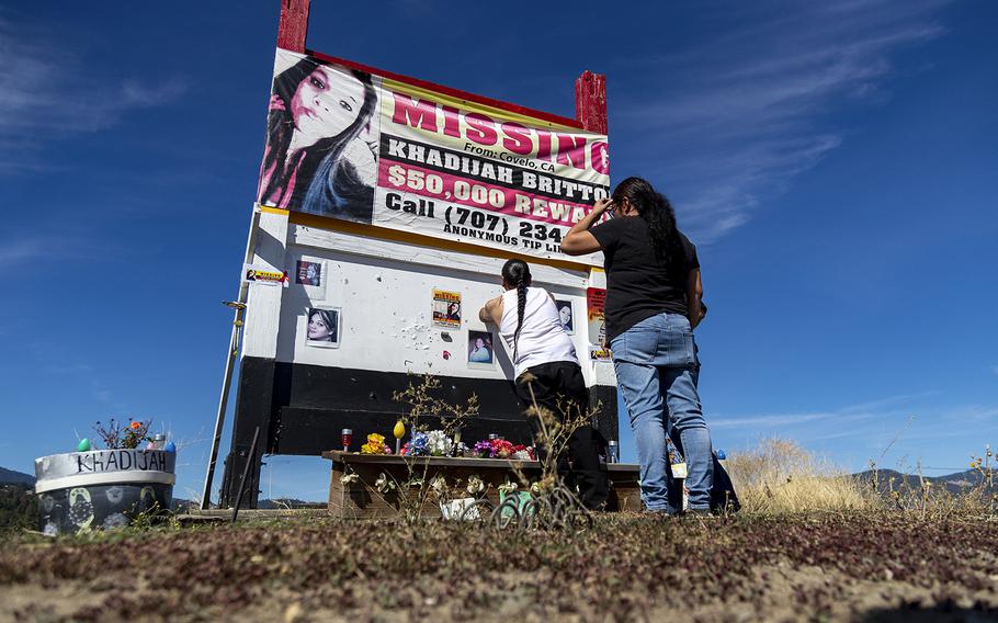 Family members put up new posters on a memorial for missing Khadijah Britton, who was last seen Feb. 8, 2018 while being forced into a car at gunpoint by ex-boyfriend Negie Fallis in Covelo, California. 